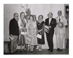 Roy W. Howard and associates posing for photograph