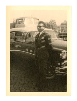 Man standing in front of car