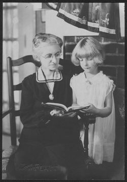 Grandma Carmichael (HC's grandmother) and a young Georgia (or Martha) Carmichael reading a book.