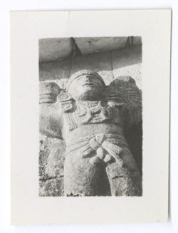 Item 0922. - 0922b. Taken at Teotihuacan. Stone statue of male figure against stone wall.