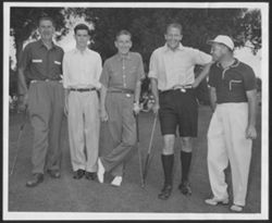Hoagy Carmichael posing with his son Randy (second from left) and three unidentified men at a golf course.