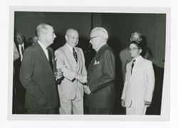 Roy Howard, other men, and a boy at an event