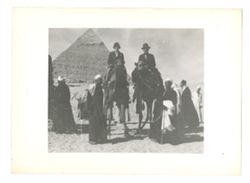 Two people on camels in Egypt
