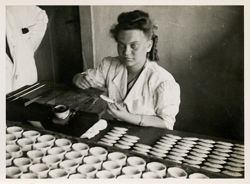 Woman painting bowls