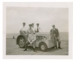 Roy W. Howard and other men on a military ship