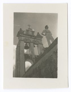 Item 1198. Eisenstein standing on the roof of a church, with an open-arched bell tower behind him. See Item 482 above.