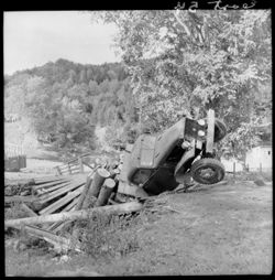 Bridge down, showing truck and logs going through