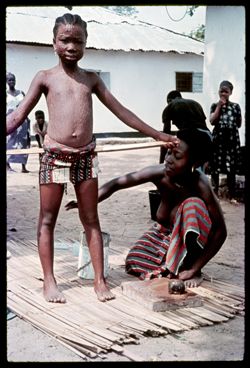 Girl receiving tribal beauty treatment