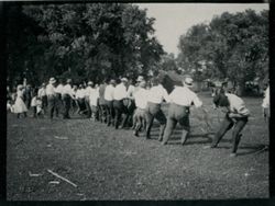 Men playing tug-of-war.