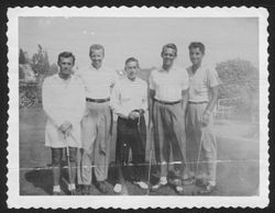 Hoagy Carmichael posing with four unidentified men.