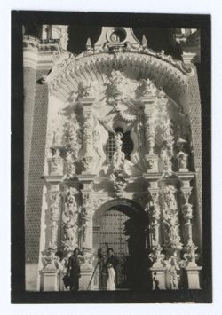 Item 1185. Tissé and Eisenstein, with camera, standing in front of ornate church façade.