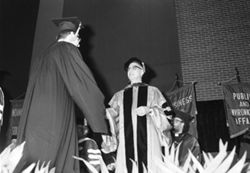 Chancellor Wolfson shakes hands with IU South Bend graduate, 1982-05-05