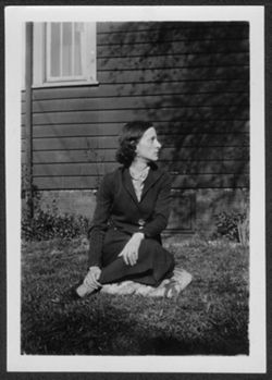 Georgia Carmichael seated in yard.