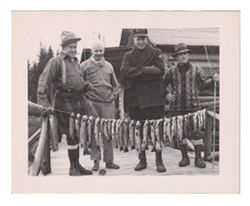 Roy W. Howard and three men on fishing trip