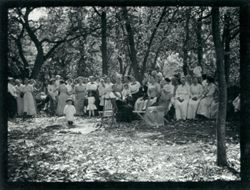 Women and children sitting in shade