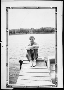 Man sitting on dock