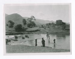 People near a river.