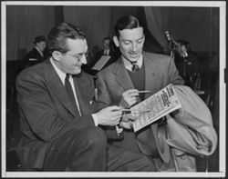 Hoagy Carmichael with Tommy Dorsey looking over music at a rehearsal for a radio show.