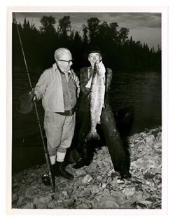 Roy Howard and another man holding fish