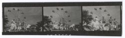 Item 0241.  Dancers at the Death Day Fiesta. They are performing on a raised wooden platform, a Ferris wheel is in the background. Long shots of two women (those seen at left and center in Item above) and three men wearing skeleton masks dancing.
