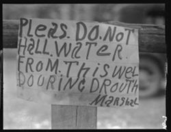 Sign at public well, by Marshal