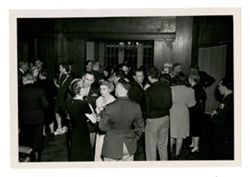 Men and women socializing at event