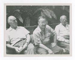 Three men sitting together at Bohemian Grove