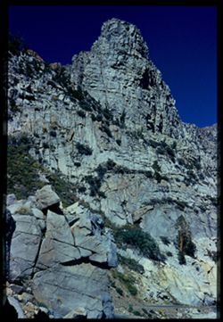 Granite pinnacle above Tioga Pass Highway east of 9946 ft.  Summer.