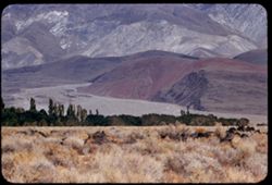 Red mound on east side of Owens Valley below Inyo Mtns. southeast of Big Pine