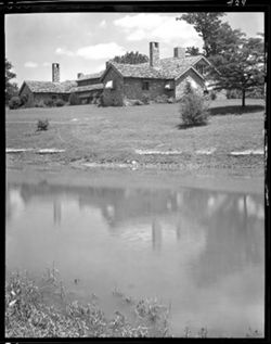 Distant view of lodge & pond