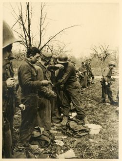 Searching of German prisoners before entering P.O.W. enclosure