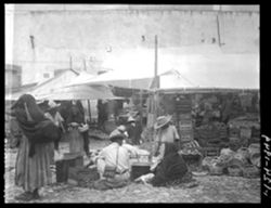 Market at Zimapan, woman talking to man in foreground