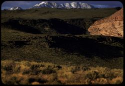 Signal Point (10, 324 ft.) of Pine Valley Mountain seen across lava ridge north of St. George, Utah