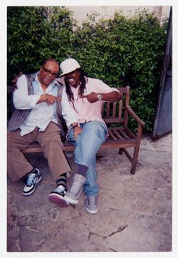 Michael Nixon and Quincy Jones sitting on park bench
