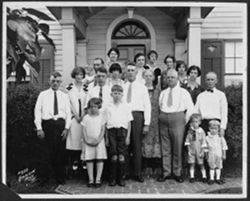 Family photograph on house doorstep.