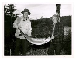 Two men holding a large fish