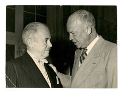 Roy Howard speaks with other man (Eisenhower?)