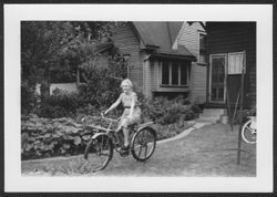 Lida Carmichael riding a bike.
