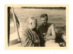 Two men talking on boat