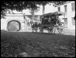 Carriage about to pass under bridge arch, Vernon