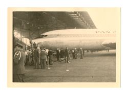 People standing in front of a Pan American airplane