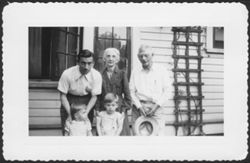 Hoagy, Grandma Carmichael, Howard, Randy, and Hoagy Bix Carmichael posing in front of a house, early 1940s.