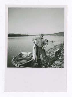 Man posing with fish