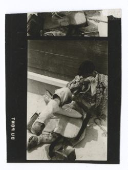 Item 0137b. Various shots of picador lying on ground with his saddle. 2 ¼ prints.