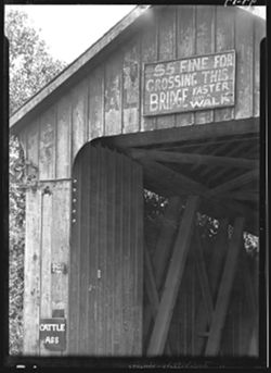 Sign on bridge at Brookville