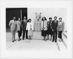 Black Filmmakers Hall of Fame members standing with bear sculpture