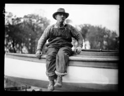 Old fisherman on boat edge, Kankakee River