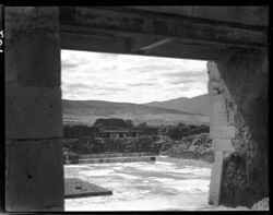 Showing sacrificial altar, through archway at Mitla