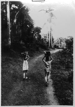 McEvoy's daughters carrying headloads