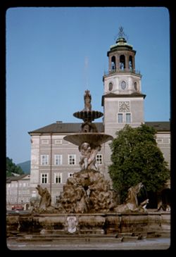 Fountain in Residenz Platz and tower of Glockenspiel  Salzburg